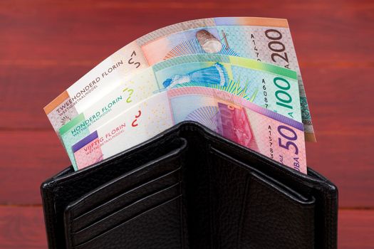 Aruban money - florin in the black wallet