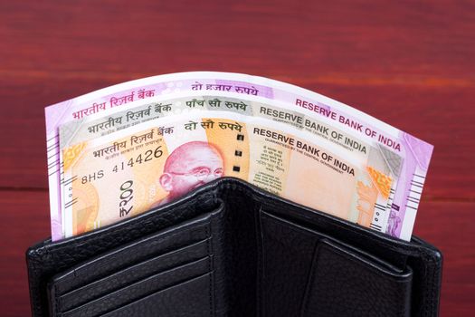 Indian money -  rupee in the black wallet