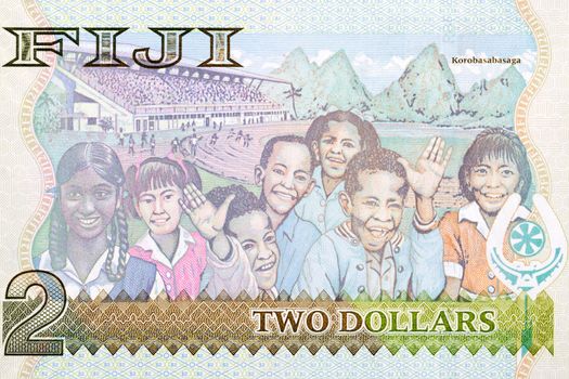School children and Mt Uluinabukulevu mountain from Fijian money