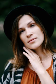 Woman with long hair wearing a hat. Portrait. High quality photo