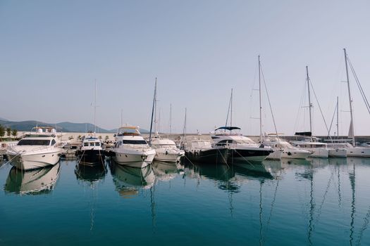 Boats are at the pier at the Lustica Bay. Montenegro. High quality photo