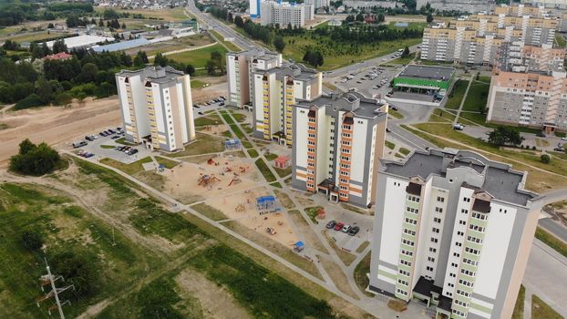 A new recently built neighborhood of apartment buildings. Drone video