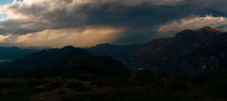 Mountain range over the Bay of Kotor in the deepening darkness. Montenegro. High quality photo