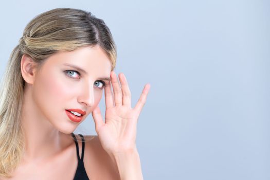 Closeup pretty beautiful woman with alluring perfect smooth and clean skin portrait in isolated background. Hand gesture with expressive facial expression for beauty model concept.