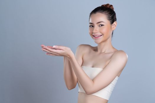 Glamorous beautiful woman with perfect smooth pure clean skincare with soft makeup in isolated background. Beauty hand gesture with expressive facial expression for advertising and indicate promotion.