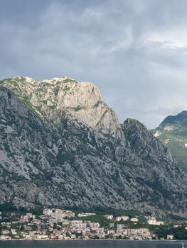 Multi-storey houses on the sea coast at the foot of the mountains. High quality photo