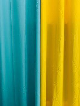 Blue and yellow textile curtains. Close-up. High quality photo
