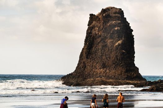 People on the sandy beach of Benijo on the island of Tenerife.Spain.