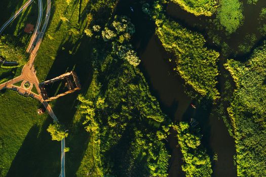 Top view of the ruins of an old mill in Loshitsky Park in Minsk and the Svisloch river at sunset.Beautiful nature of Belarus