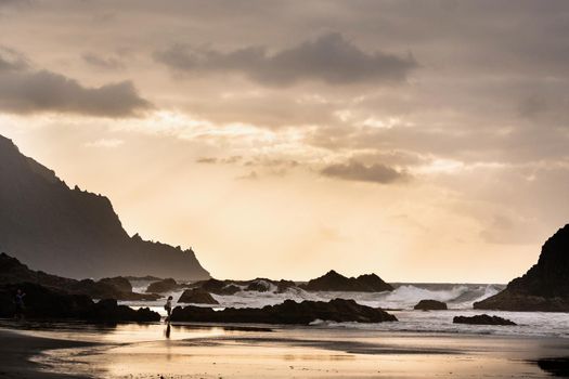 People on the sandy beach of Benijo on the island of Tenerife.Spain.