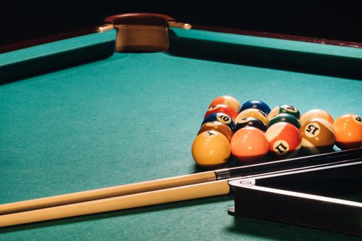 Billiard table with green surface and balls in the billiard club.Pool Game.