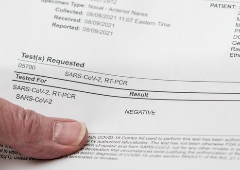 Paper printout showing a negative result for PCR test on nasal swab for SARS-CoV-2 or Covid-19
