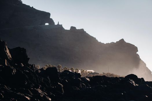 Tunnel through the mountain of Tenerife, Rocks at sunset near the Atlantic ocean of the island of Tenerife.Canary islands.Spain.