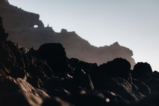 Tunnel through the mountain of Tenerife, Rocks at sunset near the Atlantic ocean of the island of Tenerife.Canary islands.Spain.