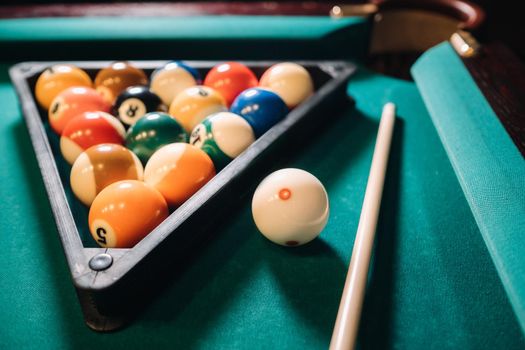 Billiard table with green surface and balls in the billiard club.Pool Game.