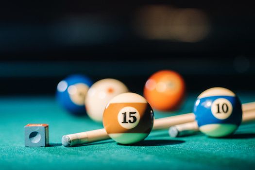 Billiard table with green surface and balls in the billiard club.Pool Game.