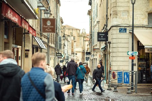 Avignon, France-April 6, 2019: Old Town Street and tourists in the center of Avignon.