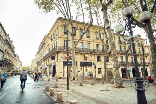 Avignon, France-April 6, 2019: Old Town Street and tourists in the center of Avignon.