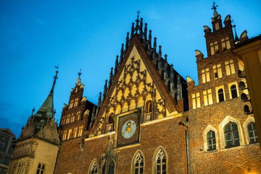 Colorful morning scene on Wroclaw Market Square with Town Hall. Sunny cityscape in historical capital of Silesia, Poland, Europe. Artistic style post processed photo.