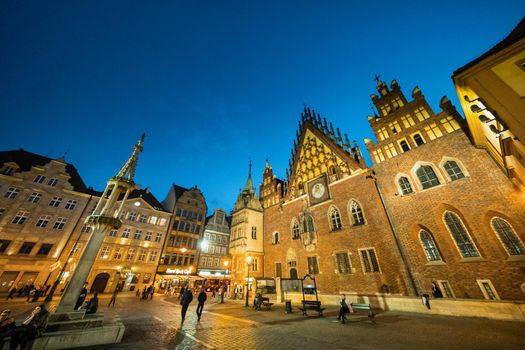 WROCLAW, POLAND-April 8, 2019:Night view of the Wroclaw Market Square with the town Hall.Europe.