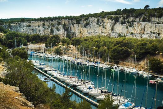 White yachts in Calanque de Port Miou, one of biggest fjords between Marseille and Cassis, France.
