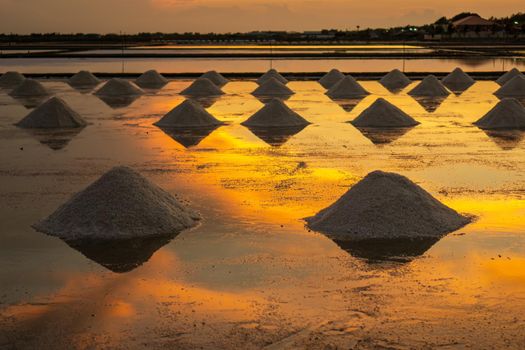 Salt in the salt fields in the evening During the shoveling of salt into the pile before transporting to the store.