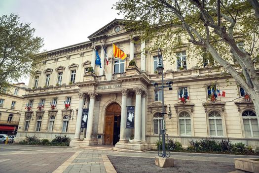 Avignon, France-April 6, 2019: Old Town Street and Hotel de Ville in the center of Avignon.