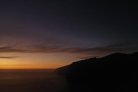 Aerial panorama of Acantilados de Los Gigantes Cliffs of the Giants at sunset, Tenerife, Canary islands, Spain