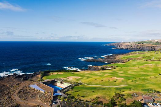 Golf course near the Atlantic ocean in Tenerife, Spain, green Golf course, tennis court in the nature of Tenerife.