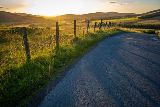 A Country Road In The Beautiful Scottish Borders During A Summer Sunset