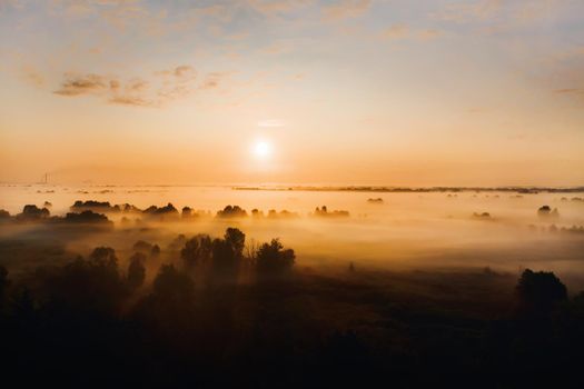 amazing sunrise in the countryside over forest expanses and fields. Amazing dawn in Ukraine and heights.Taking photos from a nature quadcopter.