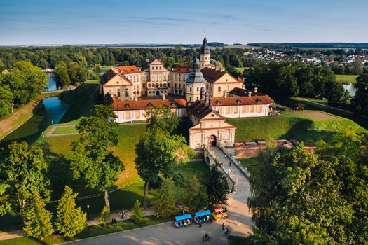 Aerial photo Nesvizh castle in autumn evening, Belarus Minsk, top view.