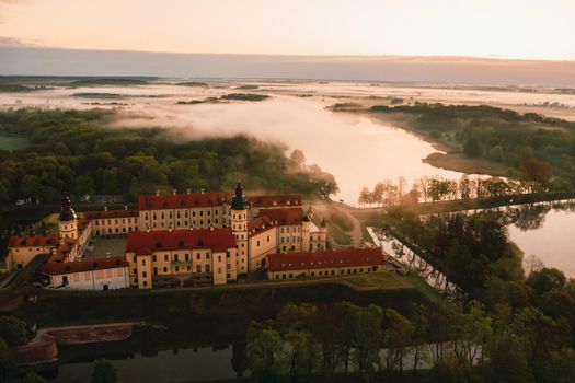 Nesvizh castle is a residential castle of the Radziwill family in Nesvizh, Belarus, with a beautiful view from above at dawn.