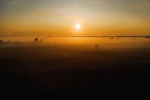 amazing sunrise in the countryside over a field of sunflowers. Amazing dawn in Ukraine and heights.Taking photos from a nature quadcopter.