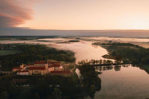 Nesvizh castle is a residential castle of the Radziwill family in Nesvizh, Belarus, with a beautiful view from above at dawn.