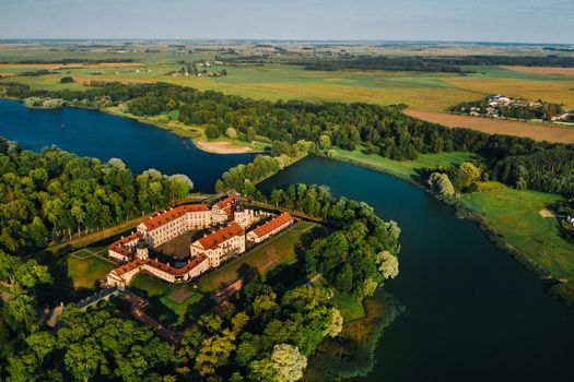 Aerial photo Nesvizh castle in autumn evening, Belarus Minsk, top view.