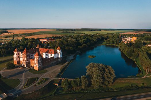 Mir castle with spires near the lake top view in Belarus near the city of Mir.