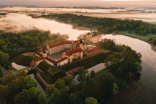 Nesvizh castle is a residential castle of the Radziwill family in Nesvizh, Belarus, with a beautiful view from above at dawn.