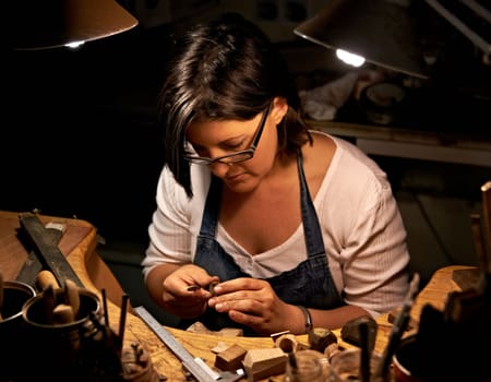 Creating something beautiful. An artist creating something out of wood