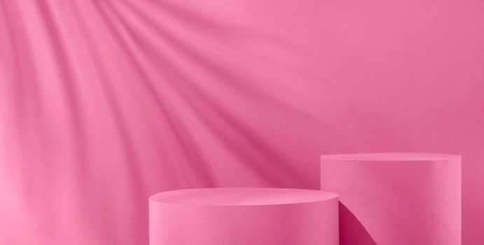 Magenta trend pastel color background with two geometric podiums to show the product and sunlight and shadow on the wall. High quality photo