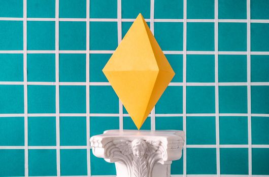 The symbol of the cryptocurrency Ethereum on an antique column in the style of vaporwave. High quality photo