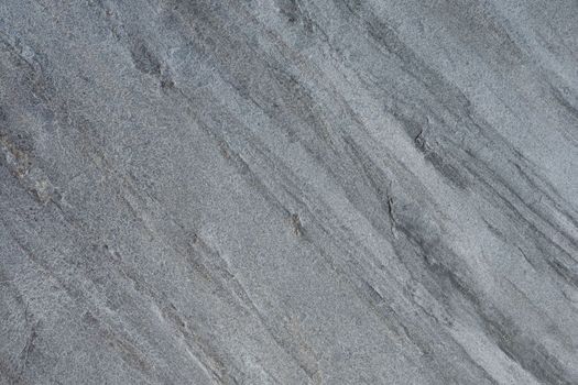 Samples of gray stone with a wavy pattern for the interior. Texture of natural stone. Natural stone surface for flooring or wall decoration