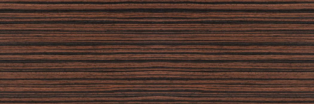 Macassar wood texture. High quality red and brown macassar wood plank surface texture. The texture of hard and heavy wood, with a beautiful surface for the production of furniture or flooring.