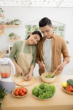  Young asian man and woman have romantic time while staying at home.