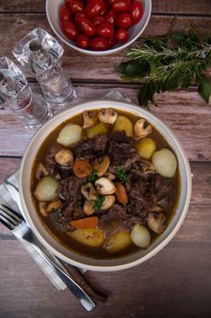 Beef bourguignon recipe, beef stew with wine sauce and vegetables. High quality photo