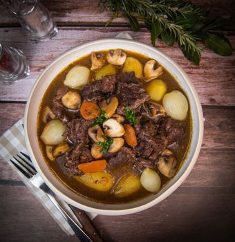 Beef bourguignon recipe, beef stew with wine sauce and vegetables. High quality photo