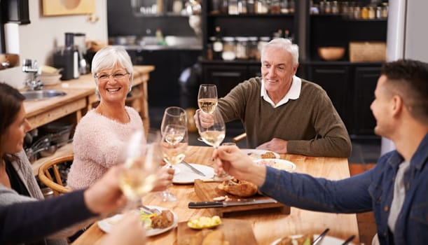 Friends and family are the true gifts in life. a family sitting down to dinner