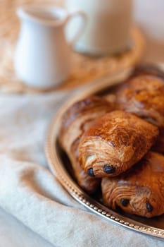 pain au chocolat, french sweet pastry speciality, side view, selective focus