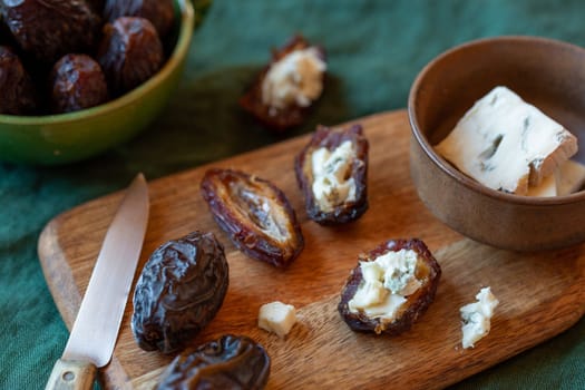 date fruits stuffed with gorgonzola cheese, side view