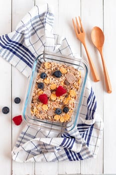 lunchbox of oat flakes with fresh fruits, zero waste, top view